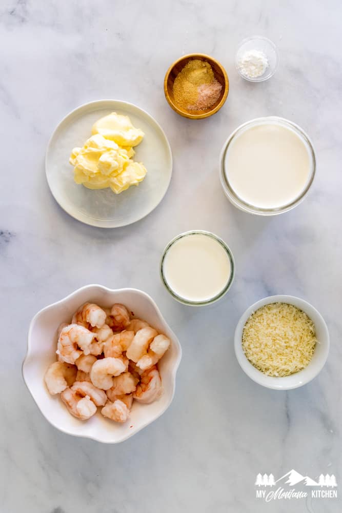 shrimp alfredo ingredients on marble surface