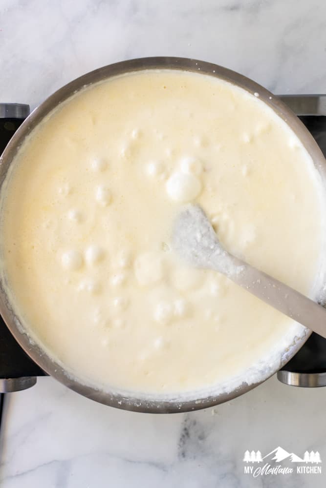 keto alfredo sauce simmering in skillet