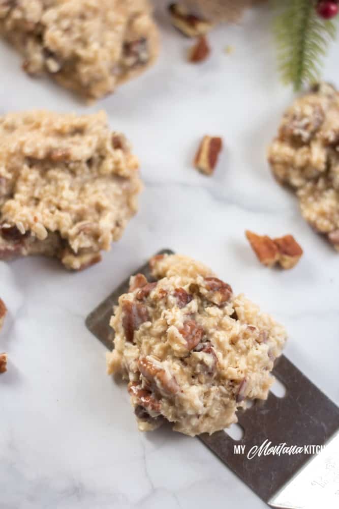 A handful of ingredients, and 15 minutes is all it takes to make these low carb Holiday Praline No-Bake Cookies. These sugar free cookies are great for keto Christmas Cookie trays! Filled with coconut, pecans, and a low carb sweetened condensed milk, these keto Christmas cookies are perfect! #ketocookie #sugarfree #lowcarbcookie #thmcookie #christmascookie #healthychristmascookie #keto #lowcarb #pralines #holidaypralines #nobakecookie