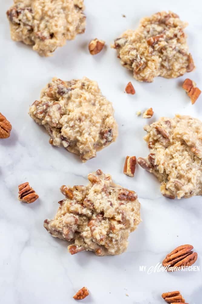 A handful of ingredients, and 15 minutes is all it takes to make these low carb Holiday Praline No-Bake Cookies. These sugar free cookies are great for keto Christmas Cookie trays! Filled with coconut, pecans, and a low carb sweetened condensed milk, these keto Christmas cookies are perfect! #ketocookie #sugarfree #lowcarbcookie #thmcookie #christmascookie #healthychristmascookie #keto #lowcarb #pralines #holidaypralines #nobakecookie 