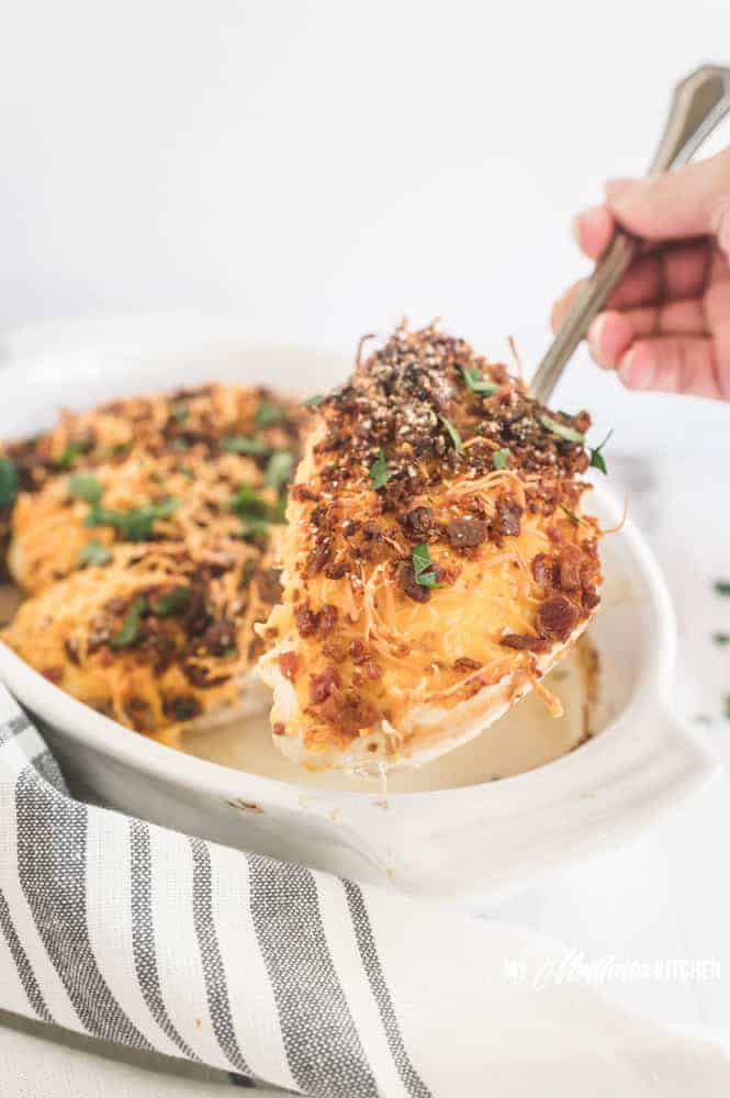 This easy chicken with bacon and cheese couldn’t be any easier! Juicy and tender chicken smothered in melty cheese and crispy bacon. This is a recipe that comes together in 5 minutes, and it makes a great weeknight dinner recipe! #cheesybaconchicken #lowcarbchickenrecipe