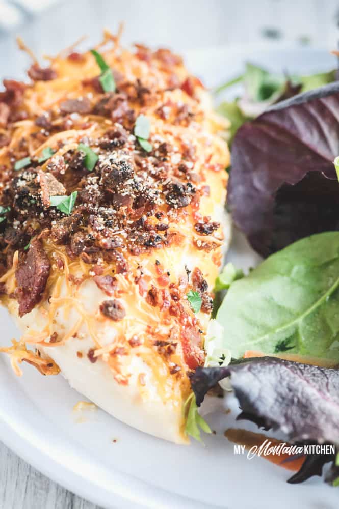 With only 5 minutes of hands on prep time (or less), this Low Carb Bacon Cheese Chicken Recipe makes an easy and delicious weeknight dinner. A healthy recipe that everyone in your family will love! #lowcarbchickendinner #baconcheesechicken