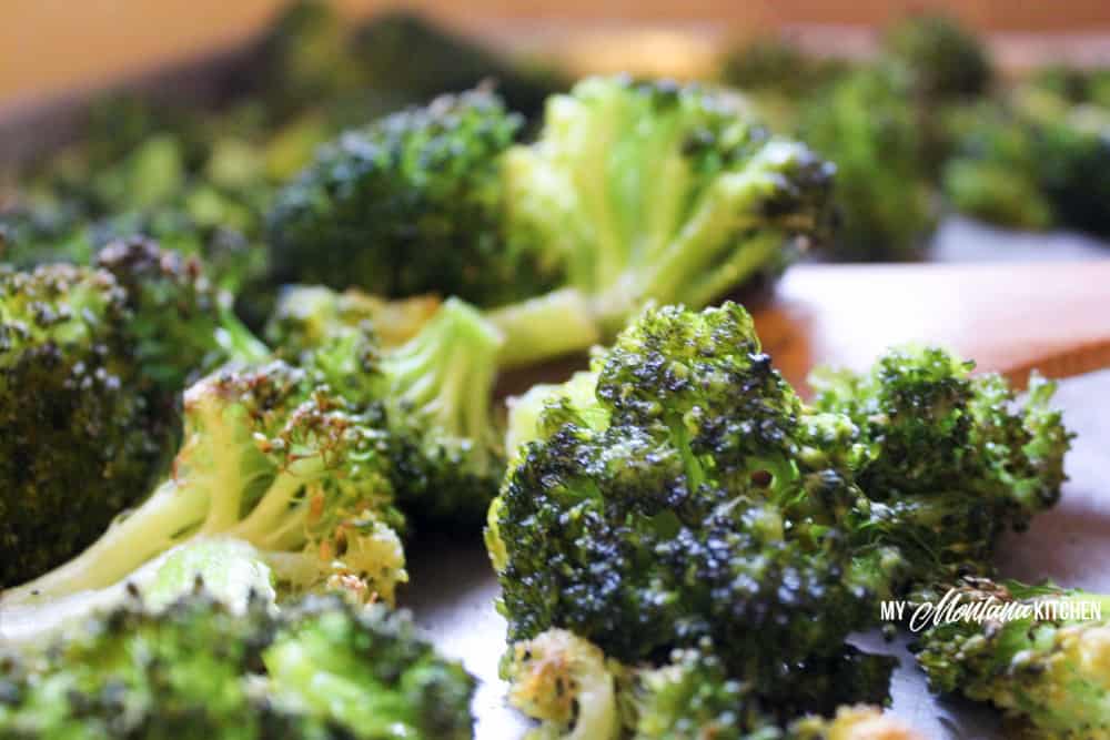 A quick and easy side dish, this Oven Roasted Broccoli Recipe only uses a handful of ingredients, but is delicious enough to become your new favorite low carb side dish! #roastedbroccoli #broccolirecipe