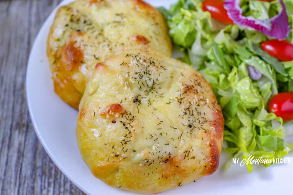 These low carb chicken bundles are made with cream cheese, chicken, and a pop of dill and then wrapped in mozzarella dough and baked to golden perfection. #trimhealthymama #thm #thms #lowcarb #keto #mozzarelladough #chickenbundles #dinnerideas #mymontanakitchen #healthydinner