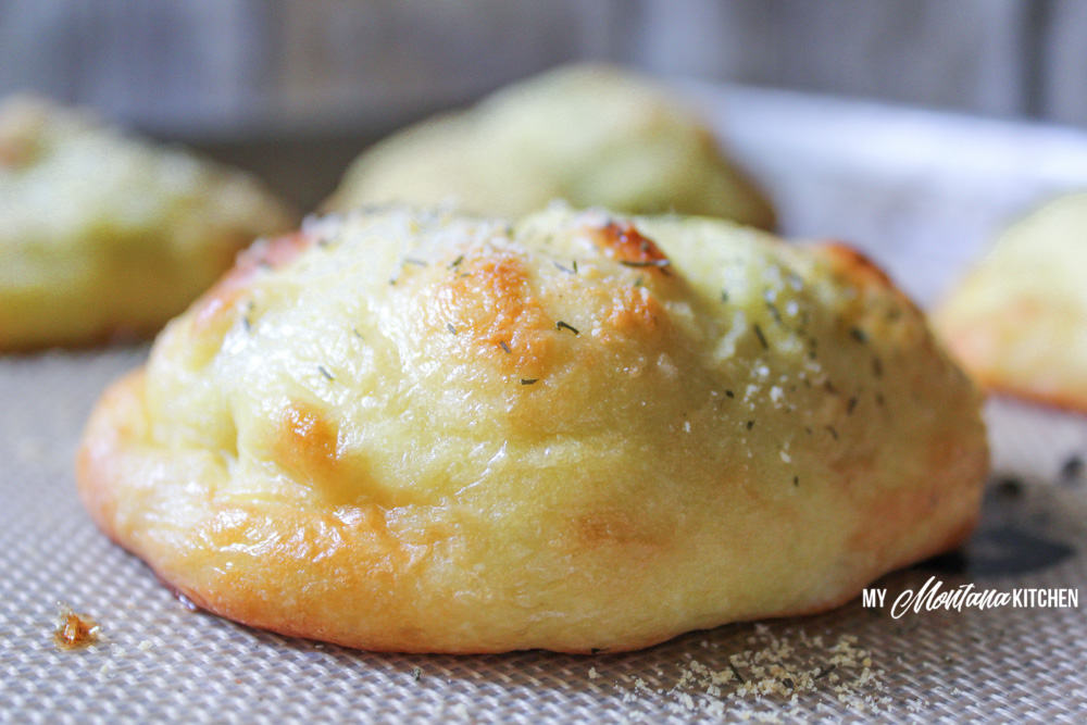 These low carb chicken bundles are made with cream cheese, chicken, and a pop of dill and then wrapped in mozzarella dough and baked to golden perfection. A perfect keto dinner idea! #trimhealthymama #thm #thms #lowcarb #keto #mozzarelladough #chickenbundles #dinnerideas #mymontanakitchen #healthydinner  