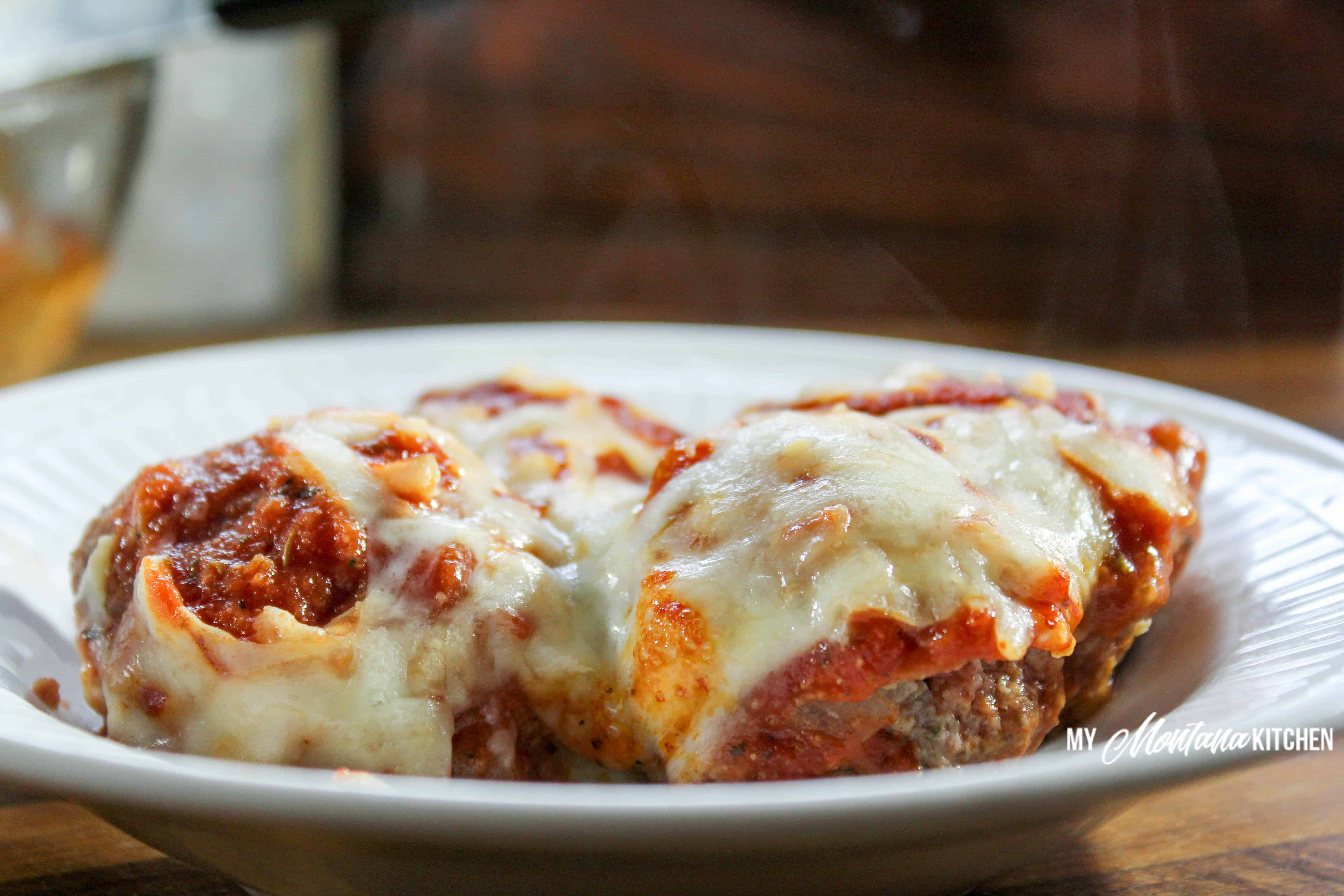 This low-carb pizza casserole is easy, savory, cheesy, and sure to be a family favorite! The meatballs can be made ahead of time and frozen, so this pizza casserole can be super quick as well. #casserole #pizza #meatballs #lowcarb #keto #trimhealthymama