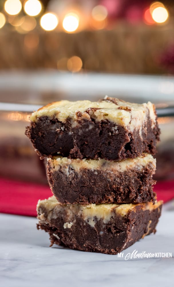 Dense, fudgy brownies topped with a creamy layer of peppermint cheesecake. This is the perfect marriage of chocolate and peppermint for a low carb, keto chocolate Christmas dessert. Works great as a Trim Healthy Mama S Dessert Recipe, too! #lowcarb #keto #thm #trimhealthymama #healthybrownie #ketobrownie #lowcarbbrownie #sugarfree #glutenfree #chocolatepeppermint #peppermintcheesecakebrownies #peppermint