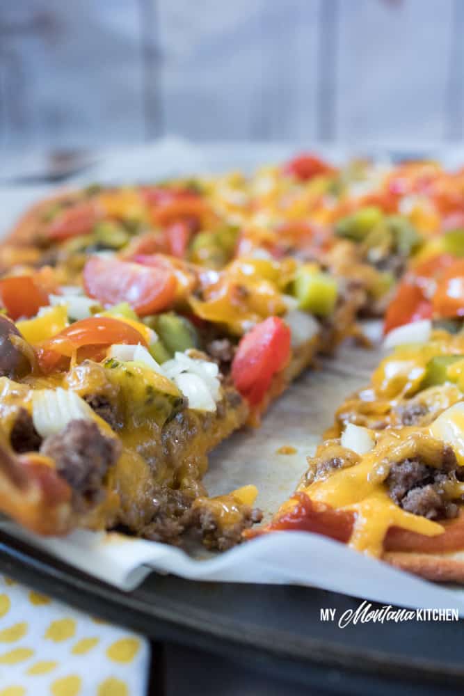 An easy low carb pizza dough makes this Cheeseburger Pizza an easy dinner idea for your family! #trimhealthymama #thm #lowcarb #keto #cheeseburger #pizza #groundbeef #easyrecipe #glutenfree