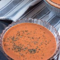 Cream cheese makes this low carb tomato soup extra creamy, while basil gives it a zesty flavor! This easy soup recipe uses no special ingredients and makes a great healthy family meal idea! #lowcarb #thm #trimhealthymama #tomato #tomatosoup #glutenfree #lowcarbsoup #healthymealidea #easylowcarbrecipe #trimhealthymamasoup
