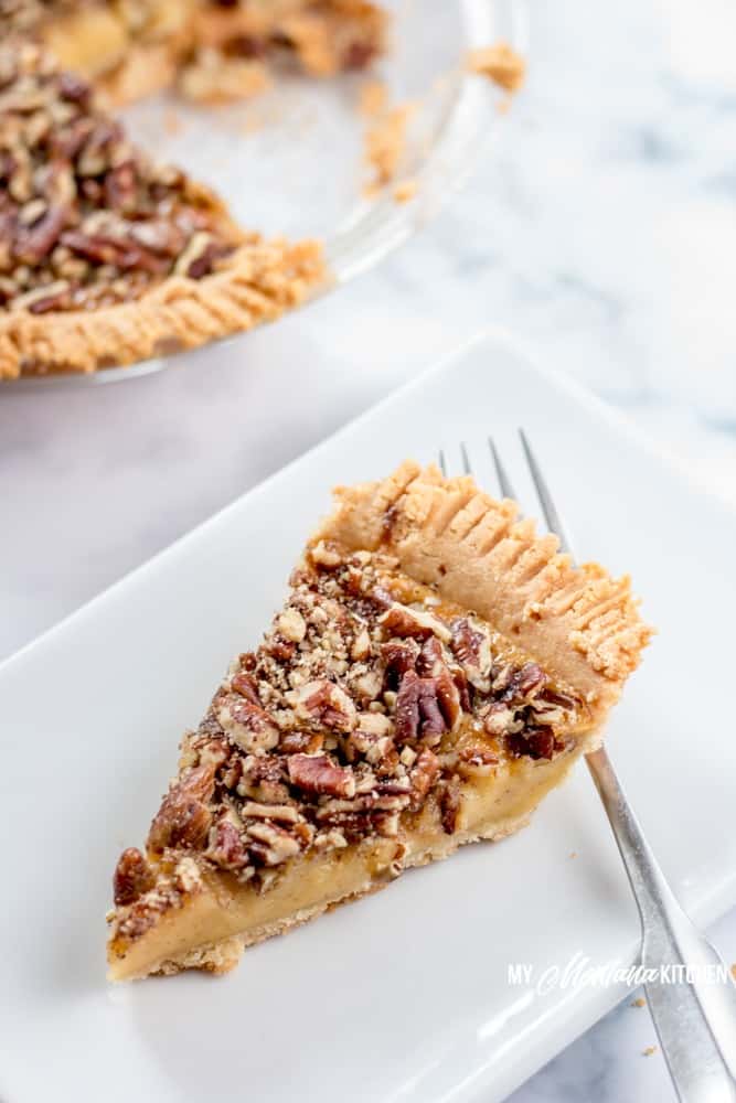 This Sugar Free Pecan Pie uses a low carb condensed milk to replace the traditional corn syrup used in pecan pie. This Low Carb Pecan Pie also works great as a Trim Healthy Mama S Dessert Recipe. #lowcarb #sugarfree #pecanpie #lowcarbpecanpie #sugarfreepecanpie #trimhealthymama #thmpecanpie #thms #glutenfreepecanpie