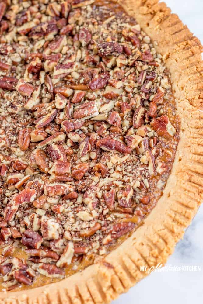 This Sugar Free Pecan Pie uses a low carb condensed milk to replace the traditional corn syrup used in pecan pie. This Low Carb Pecan Pie also works great as a Trim Healthy Mama S Dessert Recipe. #lowcarb #sugarfree #pecanpie #lowcarbpecanpie #sugarfreepecanpie #trimhealthymama #thmpecanpie #thms #glutenfreepecanpie