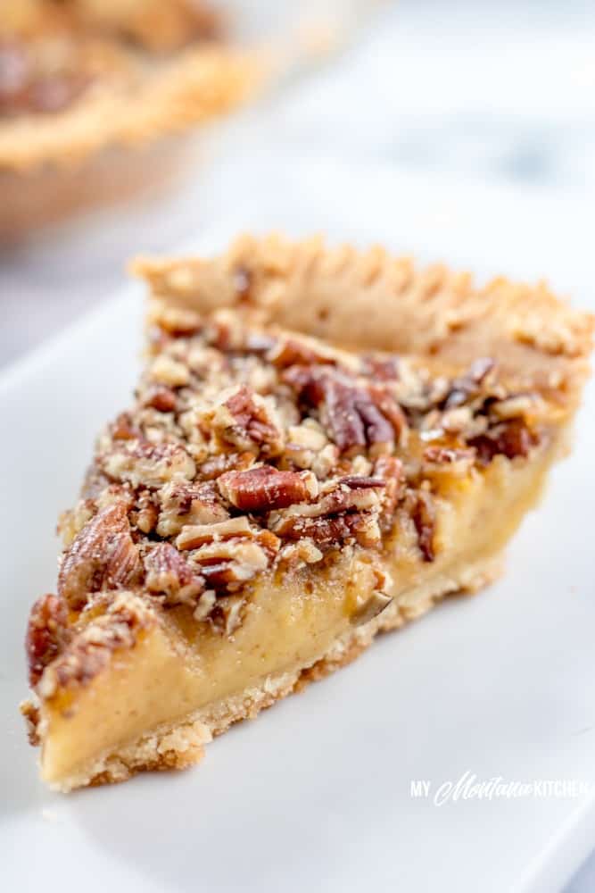 This Sugar Free Pecan Pie uses a low carb condensed milk to replace the traditional corn syrup used in pecan pie. This Low Carb Pecan Pie also works great as a Trim Healthy Mama S Dessert Recipe. #lowcarb #sugarfree #pecanpie #lowcarbpecanpie #sugarfreepecanpie #trimhealthymama #thmpecanpie #thms #glutenfreepecanpie