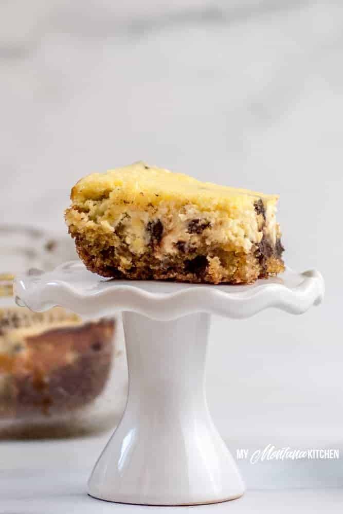 Chocolate chip cookie cheesecake bars are a decadent, delicious, low carb dessert that is easier than a traditional cheesecake to make and fun to share with company (or not share at all...I won't tell). #sugarfreecheesecakerecipe #lowcarbcheesecake