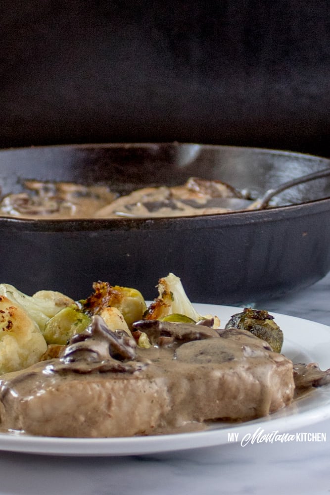 These pan seared pork chops topped with creamy mushroom sauce provide an easy, delicious, one skillet meal perfect for a busy weeknight dinner or a special occasion. These delicious pork chops are low carb and Trim Healthy Mama friendly, too! #panfriedporkchops #lowcarbdinner