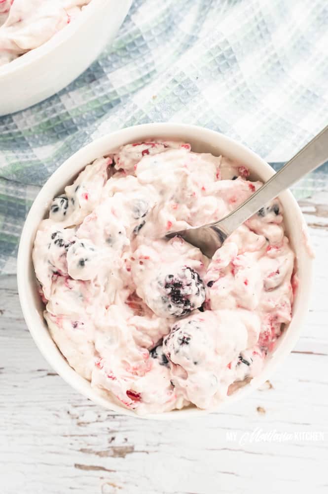 This easy Cheesecake Berry Salad recipe works for keto, THM, and it is also sugar free. Fresh berries wrapped in a cheesecake “fluff” make an excellent dessert or side! #cheesecakeberrysalad #thm #keto