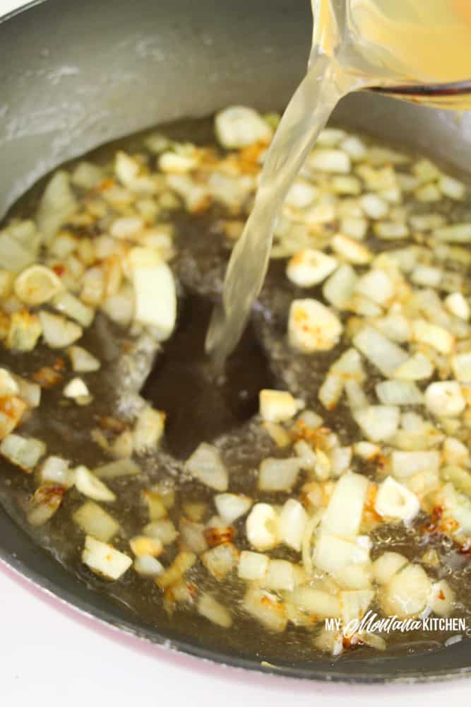 adding in broth with the onions