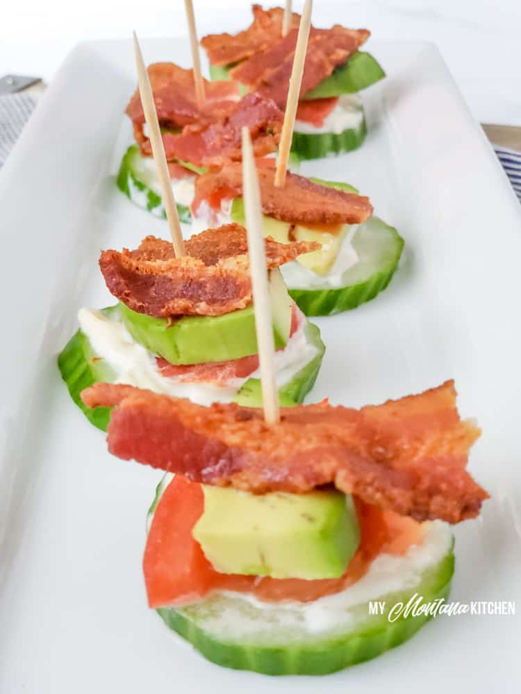 keto blt bites with toothpicks on long white plate