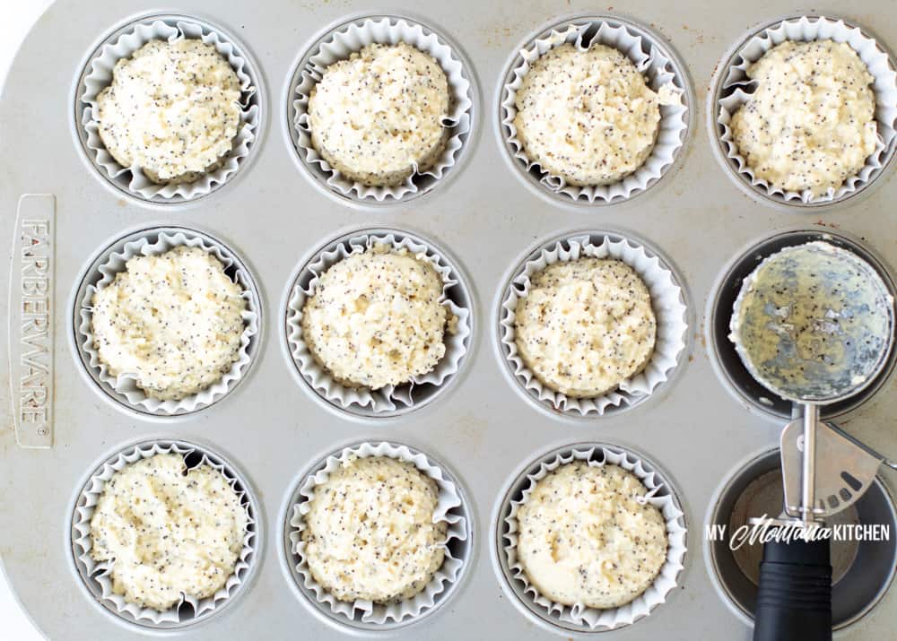 adding the muffin batter into the muffin tin