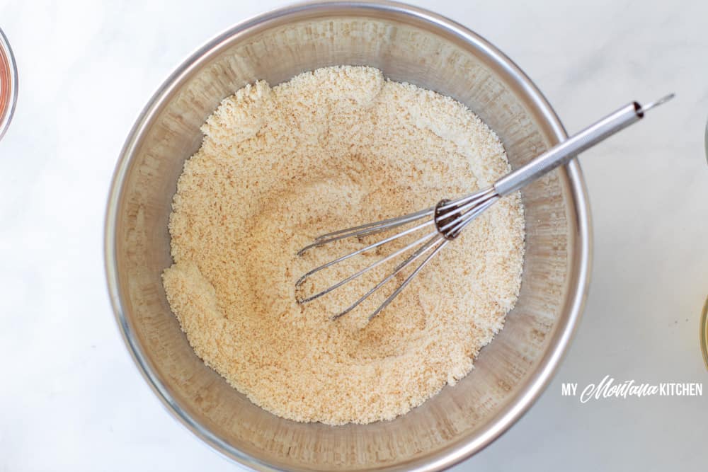 stirring together the dry ingredients in the keto lemon muffins 