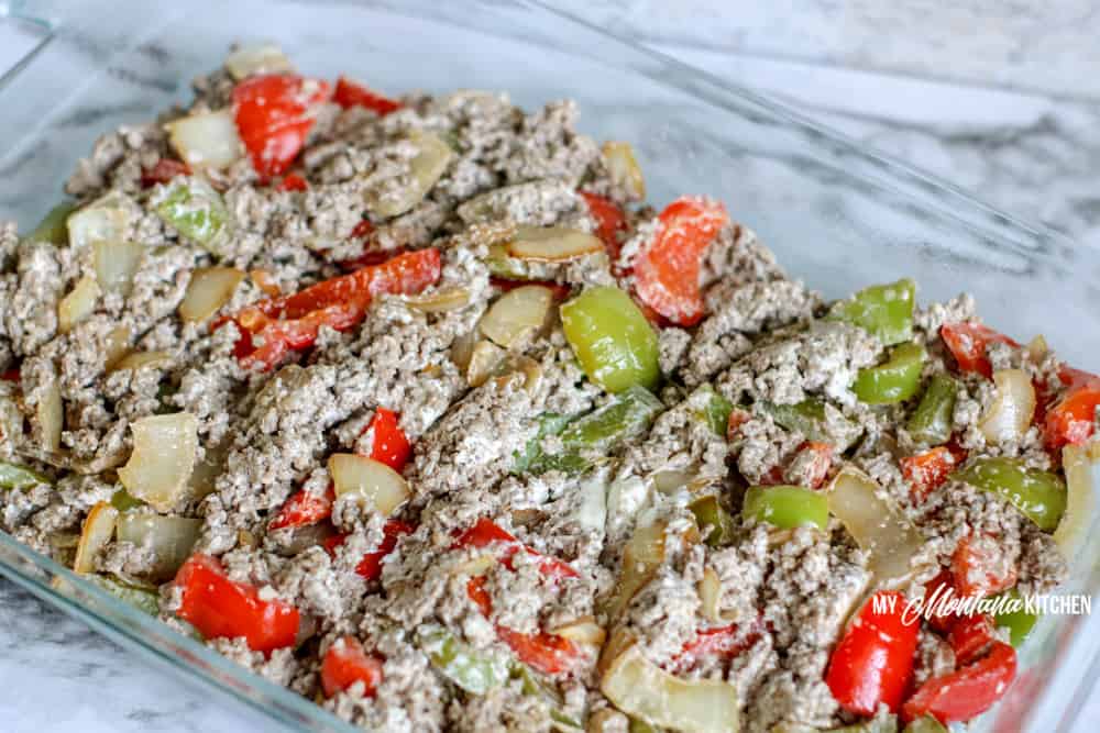 ground beef with peppers onions and cream cheese in casserole dish