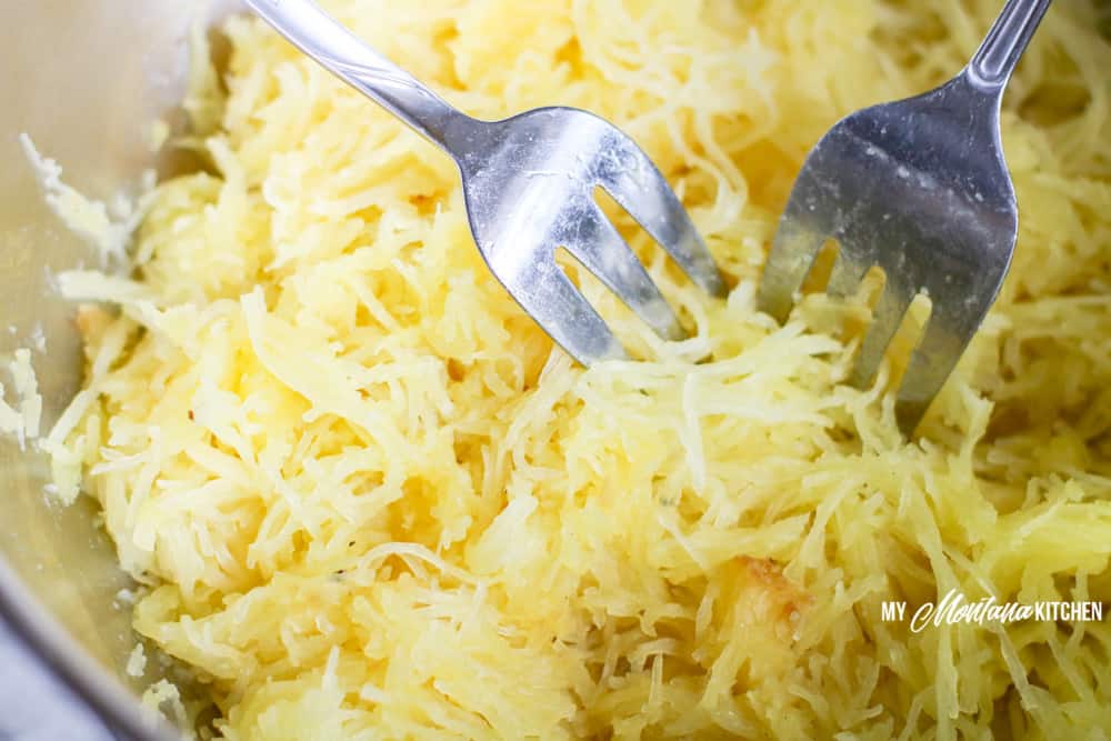 shredded cooked spaghetti squash with two forks