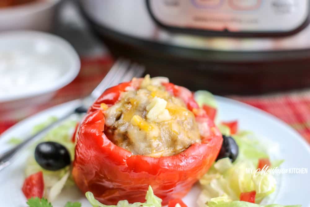 cooked stuffed pepper on white plate