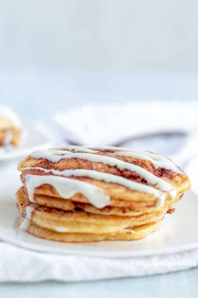 Low Carb Cinnamon Roll Pancake drizzled with cream cheese frosting