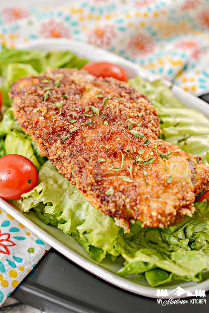 low carb Parmesan pork chop on lettuce