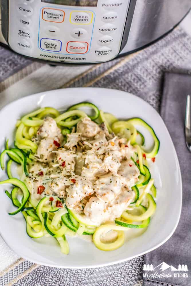 keto instant pot alfredo over zucchini noodles on white plate