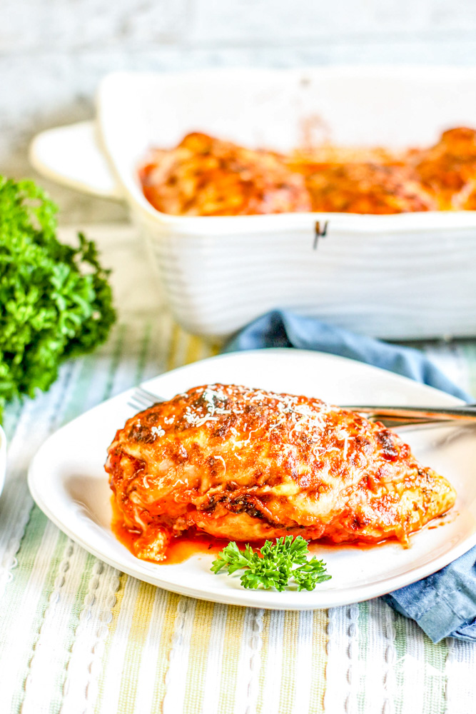 lasagna stuffed chicken breast on white plate