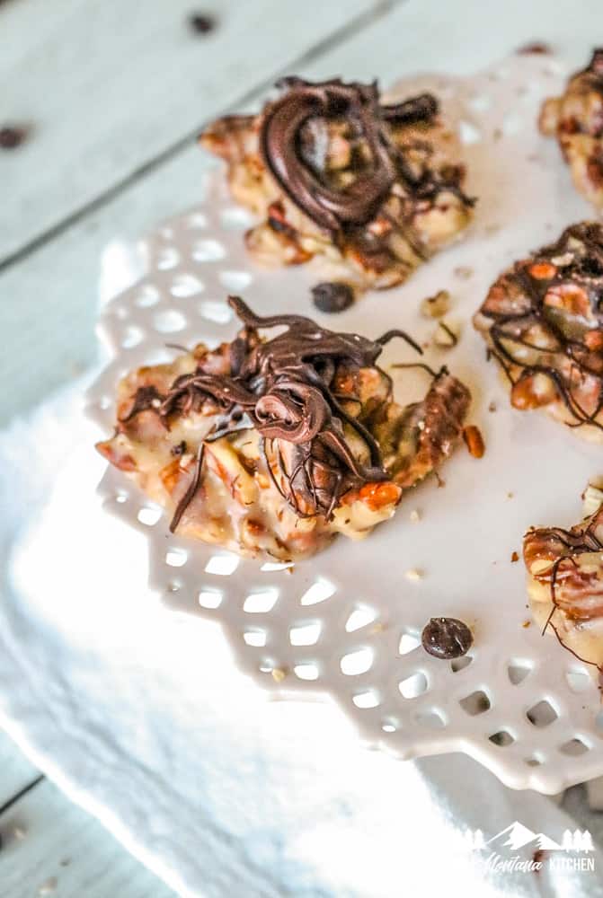 keto caramel pecans with chocolate on white plate