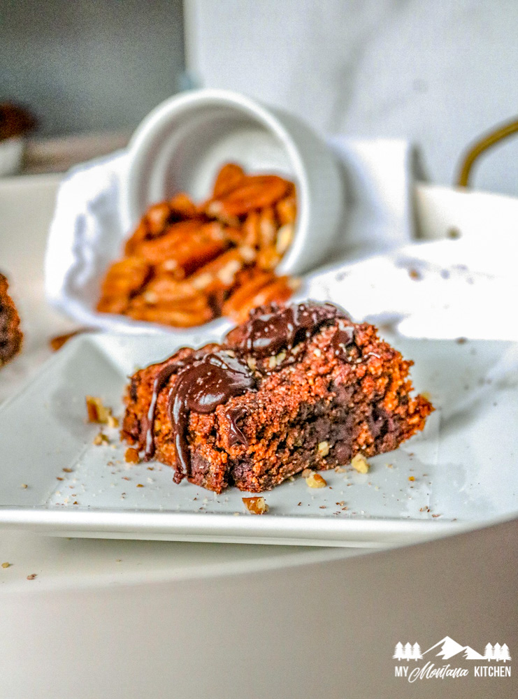 low carb pumpkin brownies on white plate with pecans