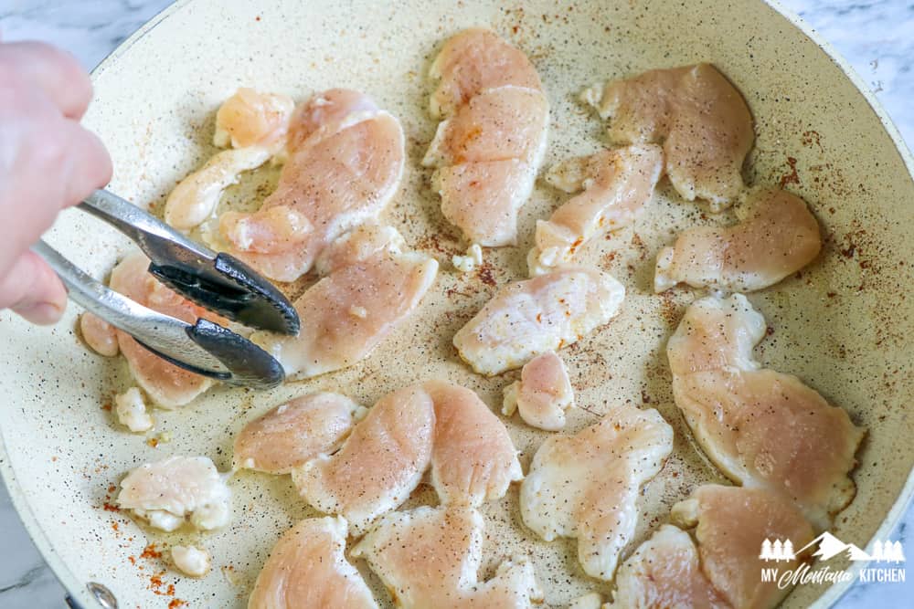 chicken frying in skillet