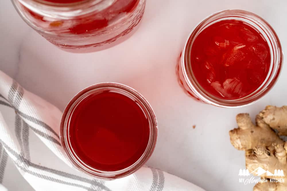 red tropical punch acv drink in mason jars