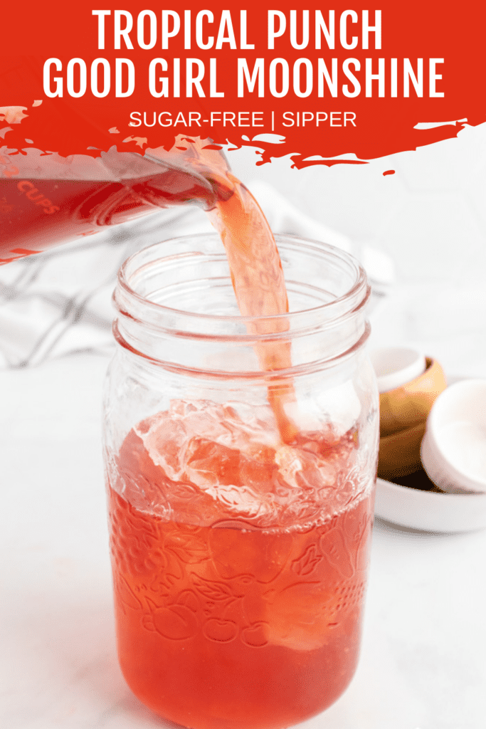 tropical punch acv drink being poured into mason jar