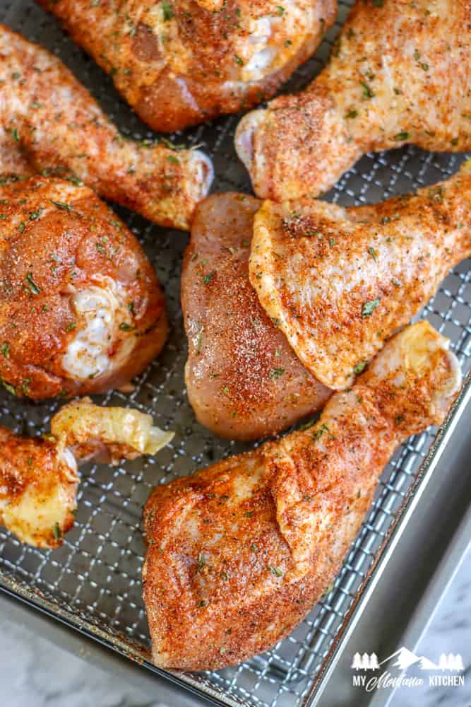 raw chicken drumsticks with olive oil and seasoning