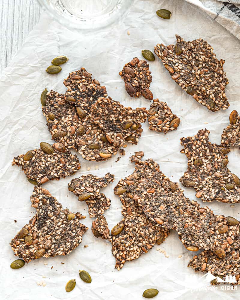 baked seed crackers on parchment paper