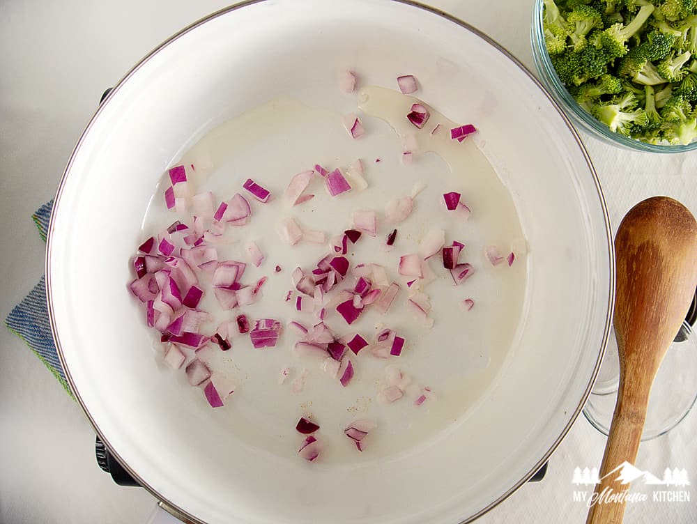 cooking onion in white pot