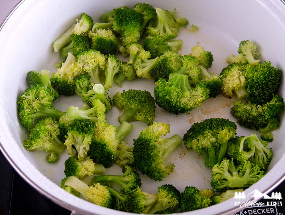 broccoli cooking in white pan