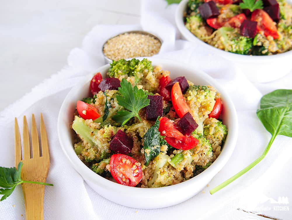 quinoa broccoli salad in white bowl