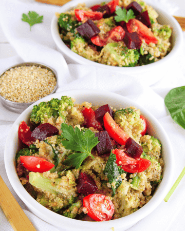 quinoa salad with beets and broccoli in white bowl