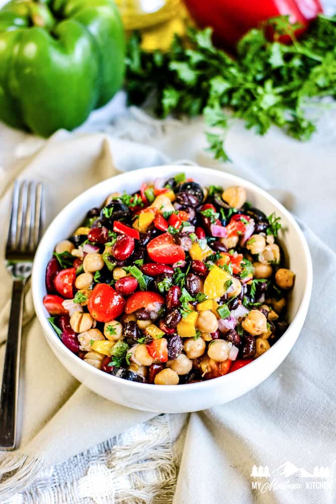 colorful three bean salad in white bowl