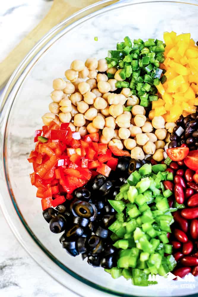 colorful beans and vegetables in glass bowl