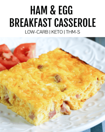 breakfast casserole on white place with tomatoes