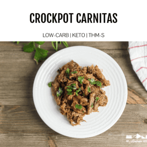 slow cooker pork carnitas on white plate