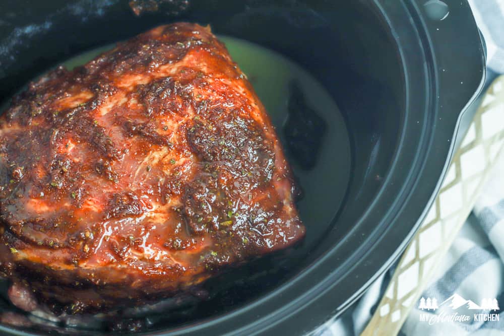 pork shoulder with spice rub in slow cooker