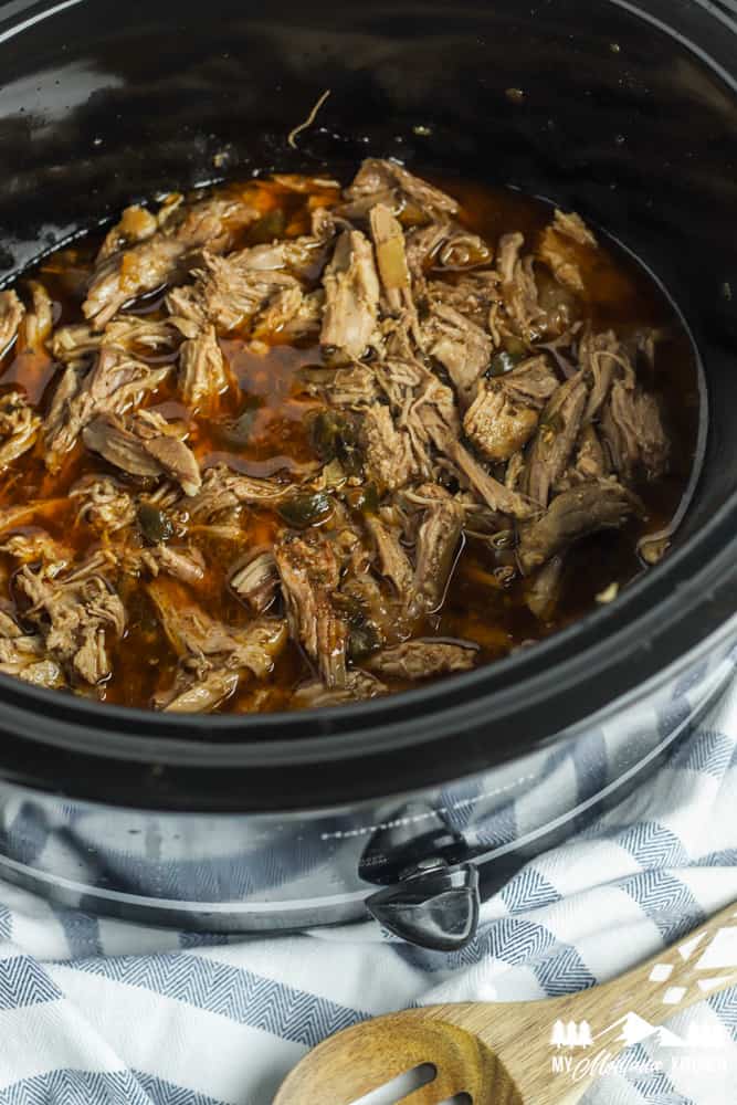 crockpot carnitas in juices in slow cooker