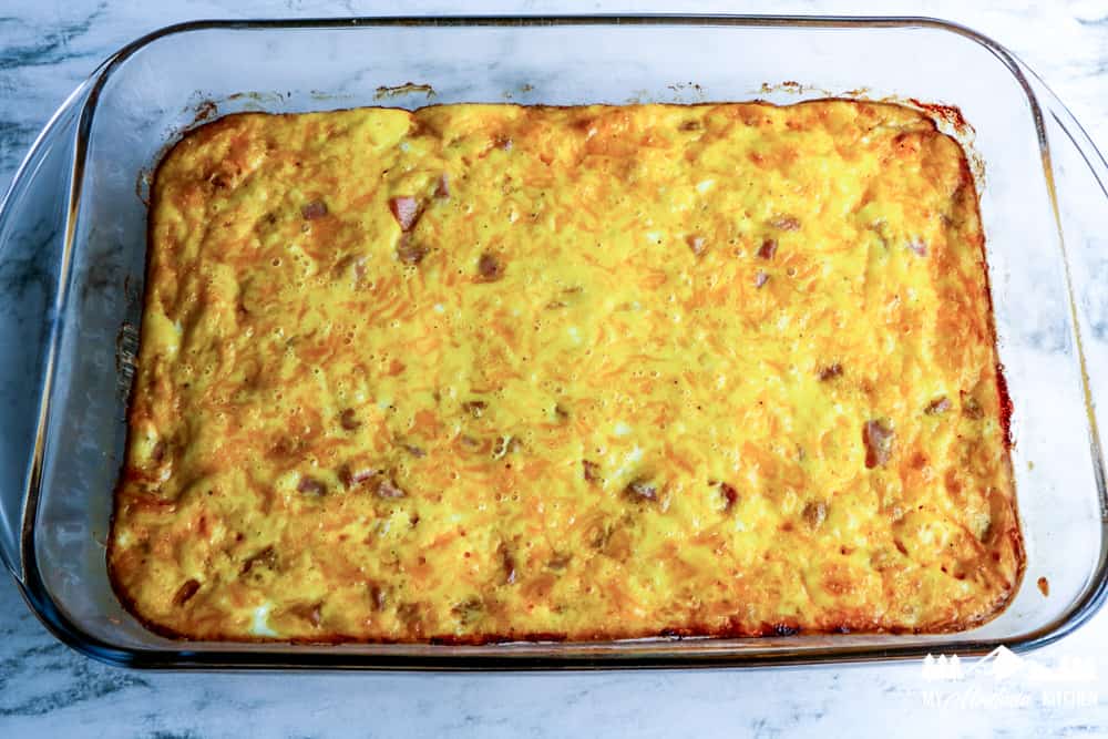 completely baked ham egg casserole in glass baking dish