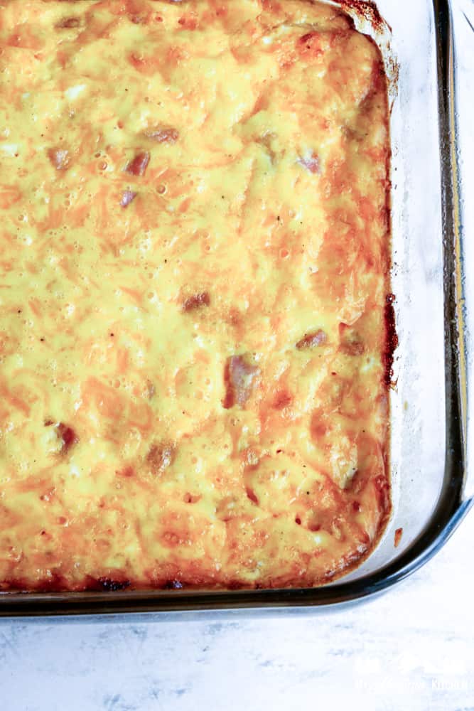 ham and cheese egg casserole in glass baking dish