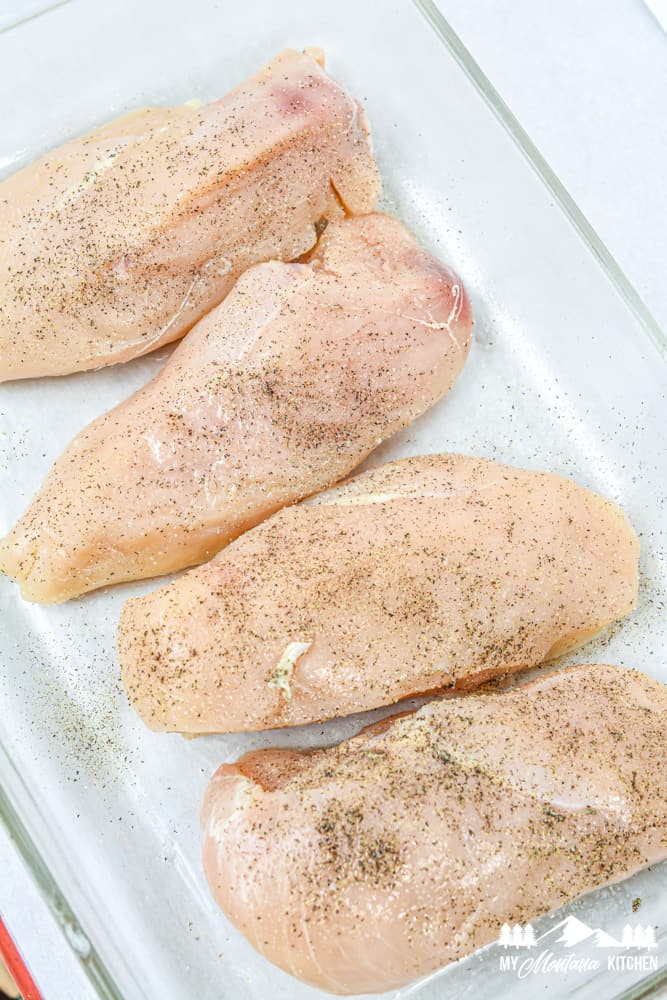 raw chicken breasts in glass baking dish